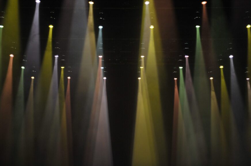 A stage with many colorful light beams.