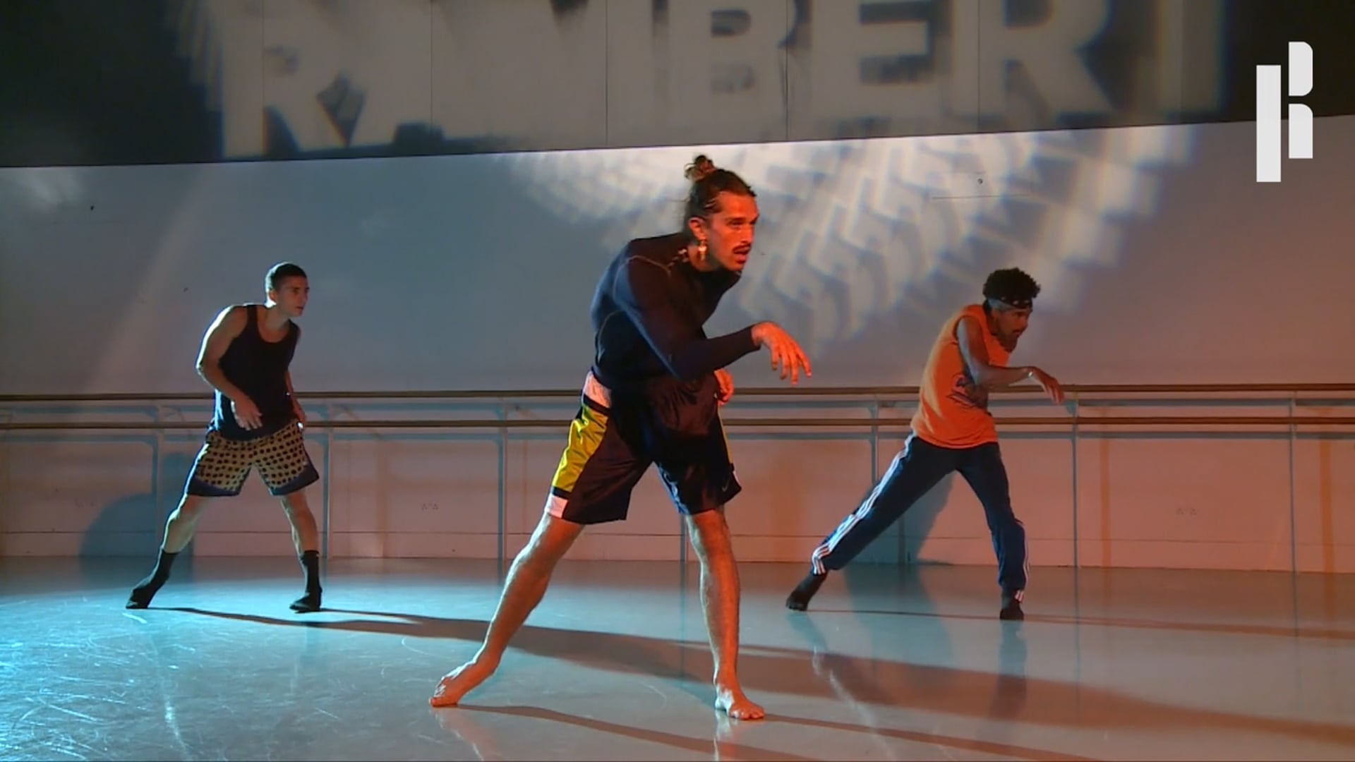A group of dancers in a dance studio.
