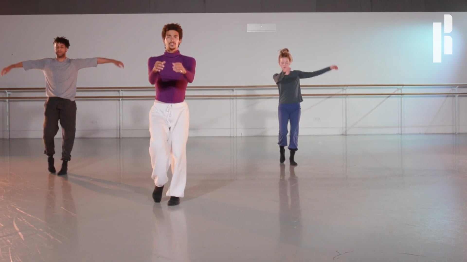 A group of dancers in a dance studio.