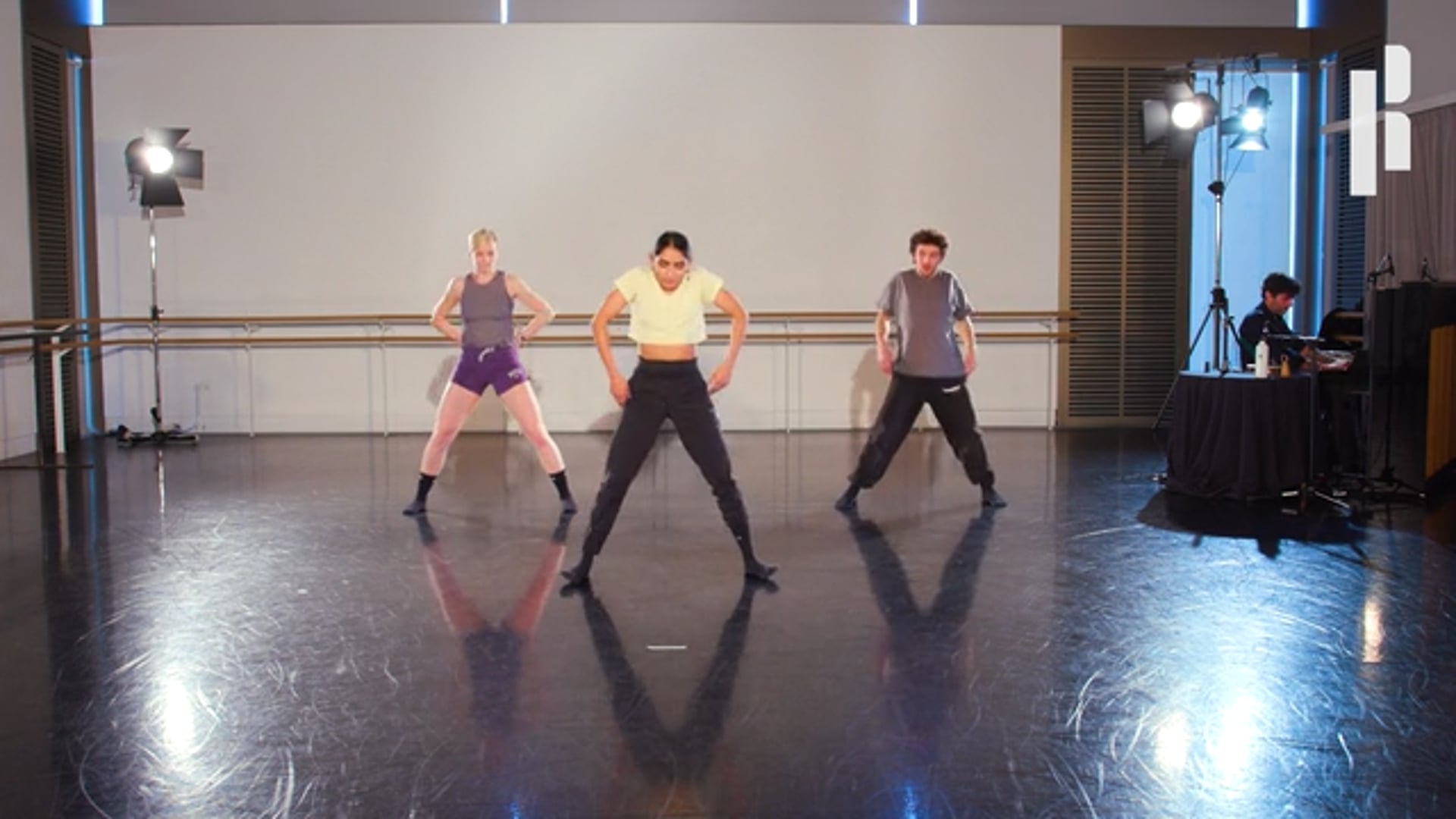 A group of dancers in a dance studio.