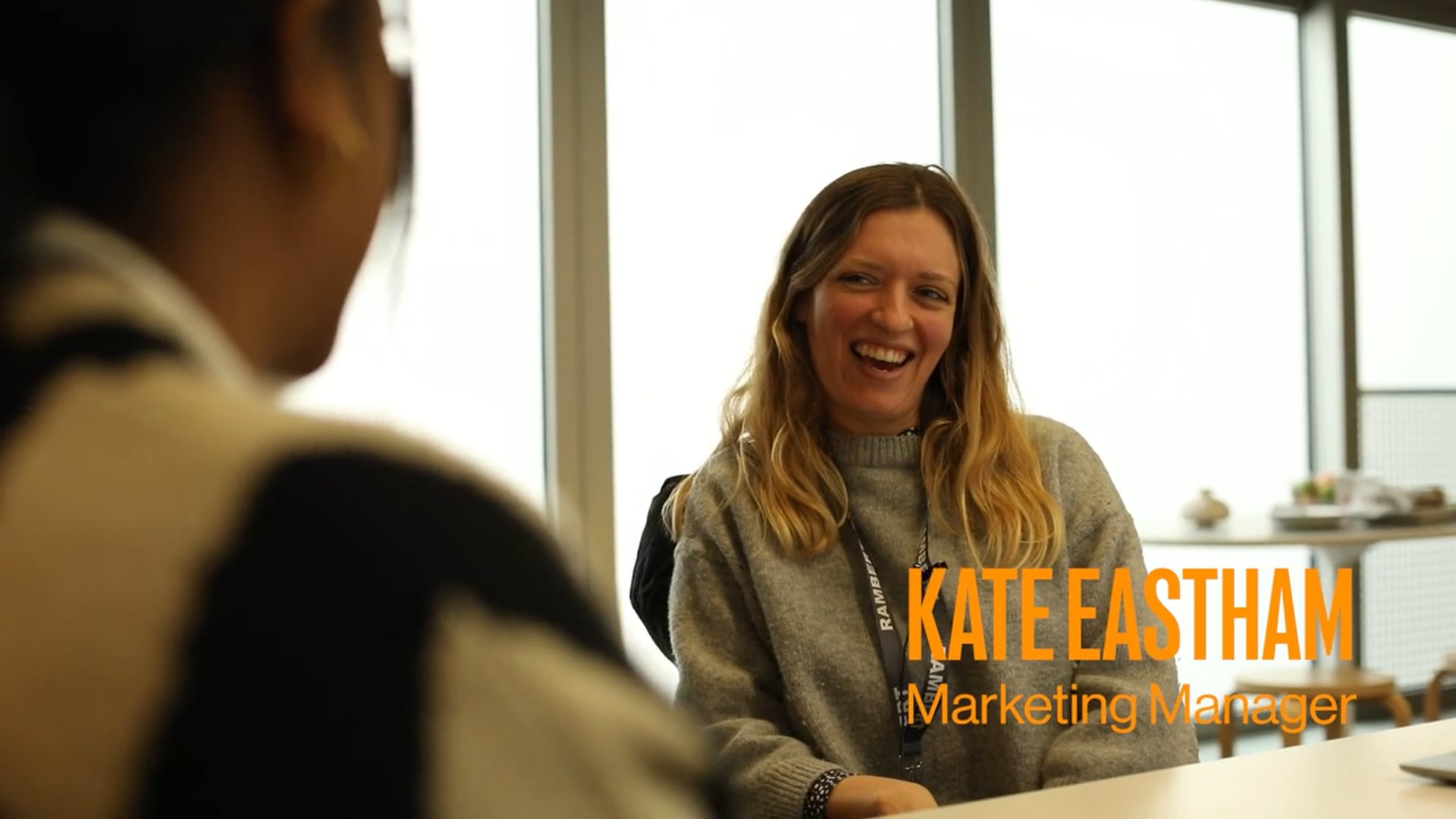 Two women sitting at a table with the words kathleen taylor marketing trainer.