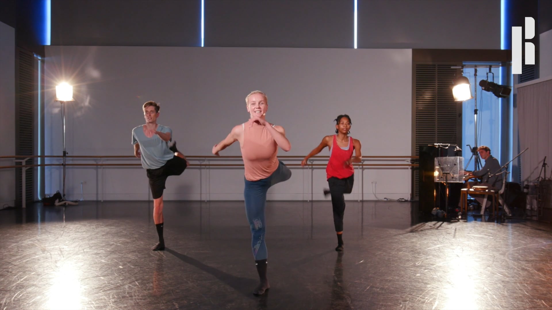 A group of dancers in a dance studio.