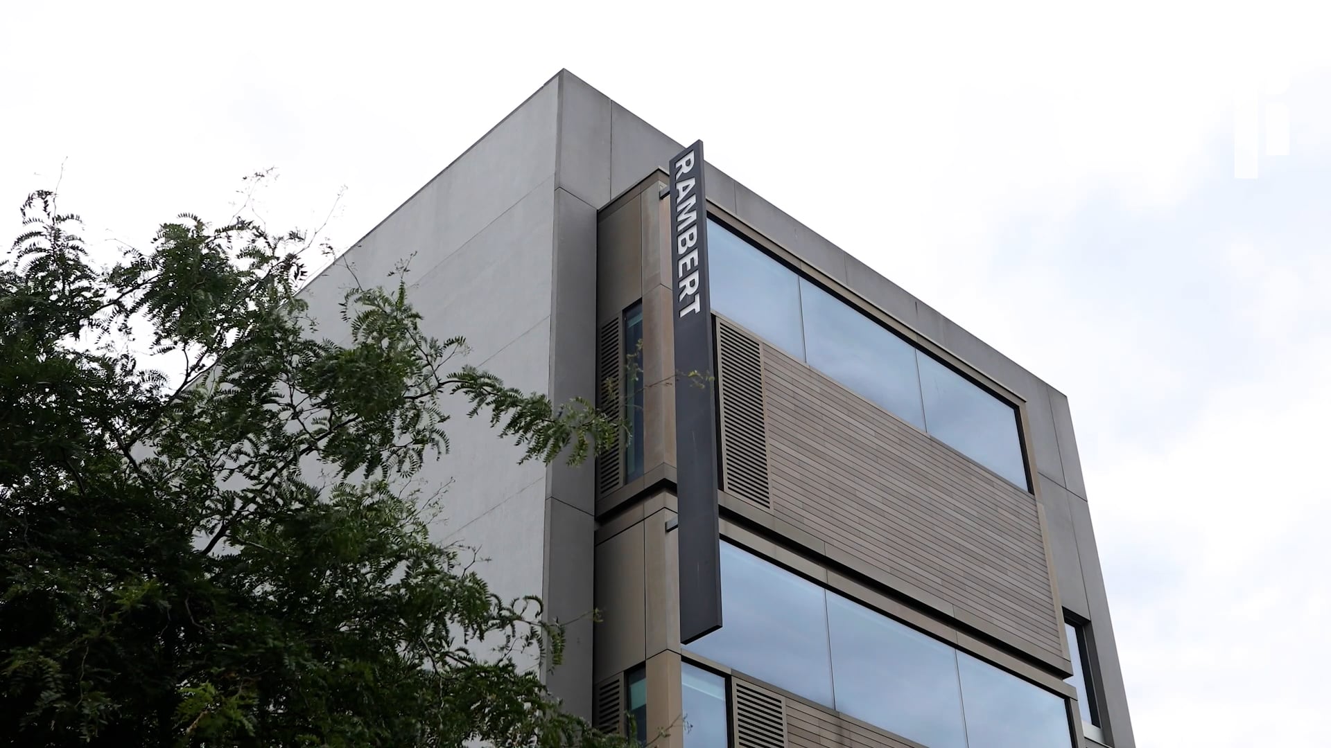 A building with a sign on the side of it.