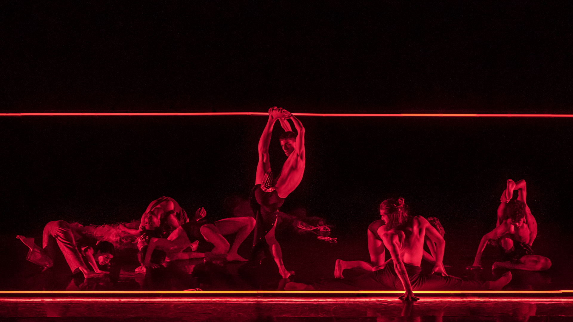 a group of naked people in a dark room.
