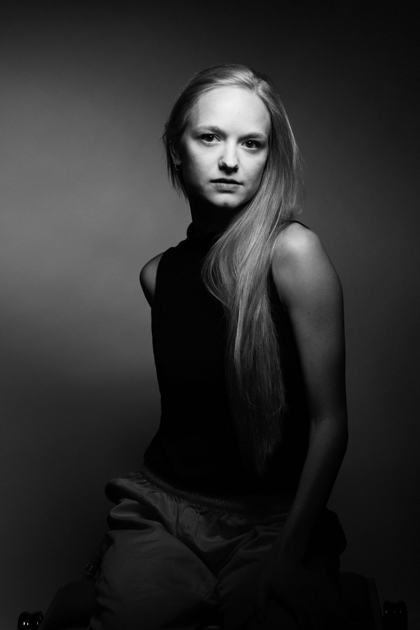 a black and white photo of a woman with long hair.