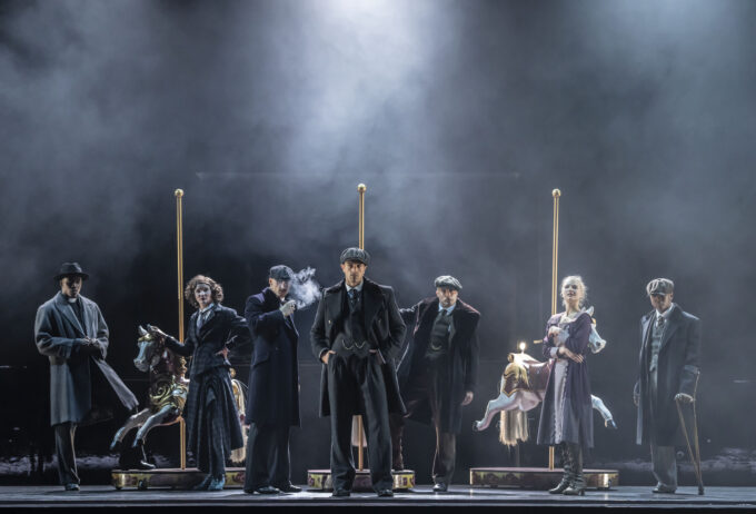 a group of people standing on top of a stage.