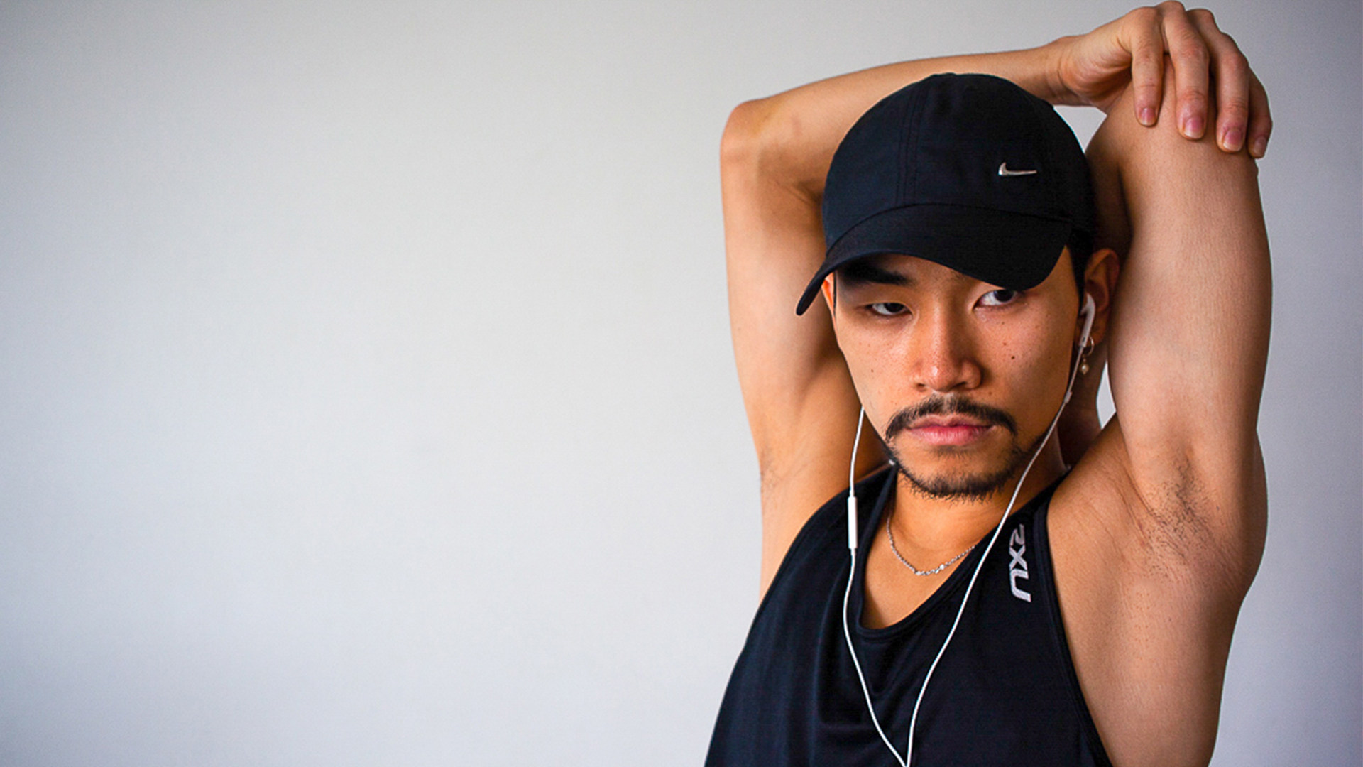 a man with a hat and headphones on.