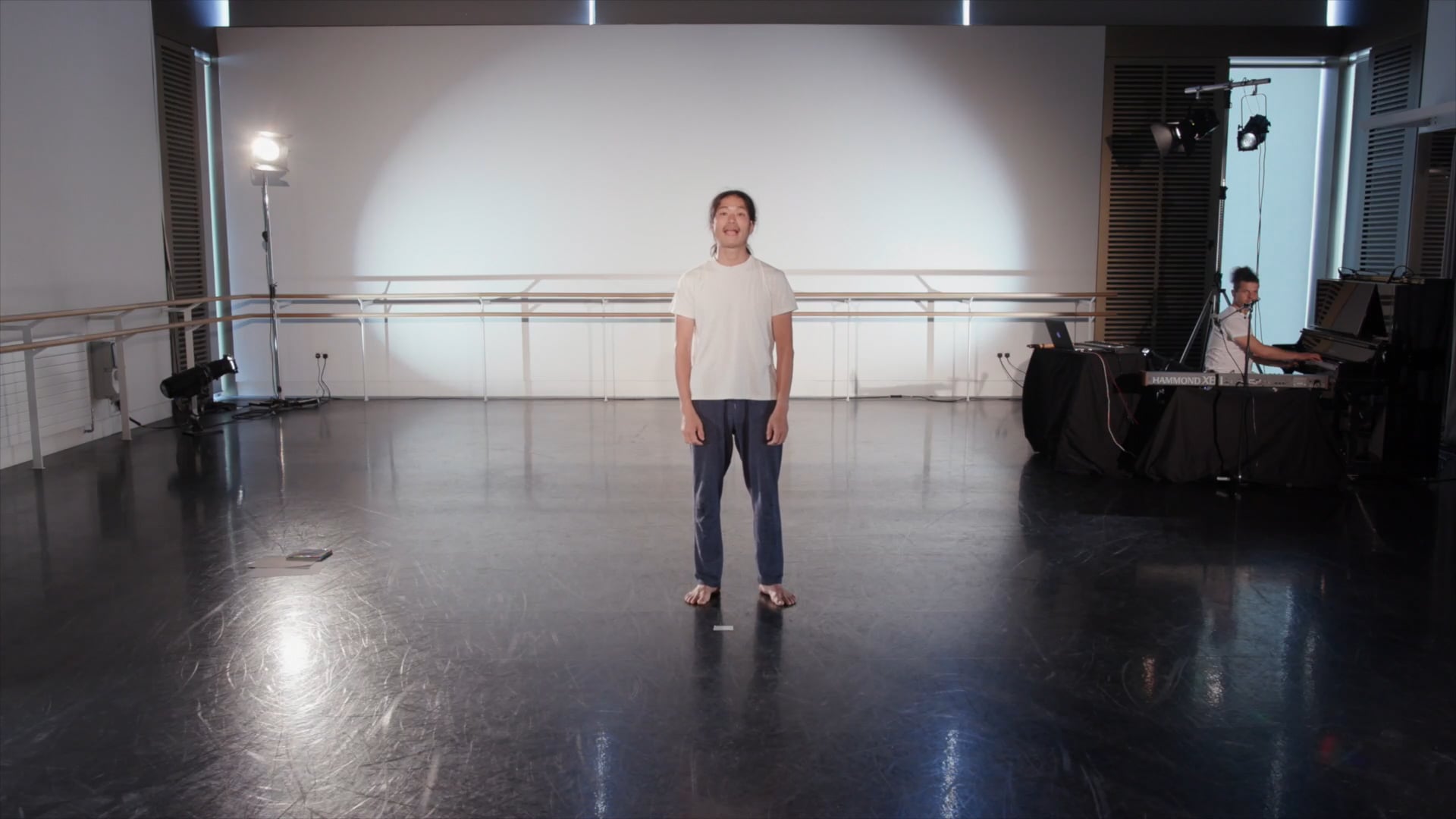 a man is standing in a large room.