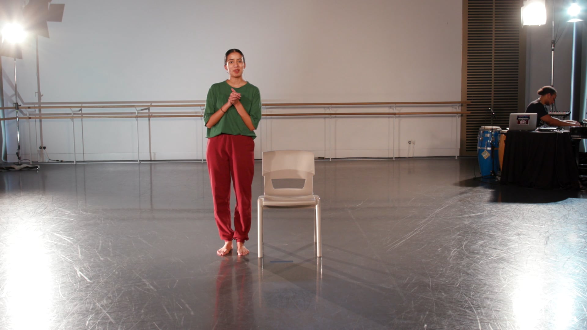 a person standing in a room with a chair.