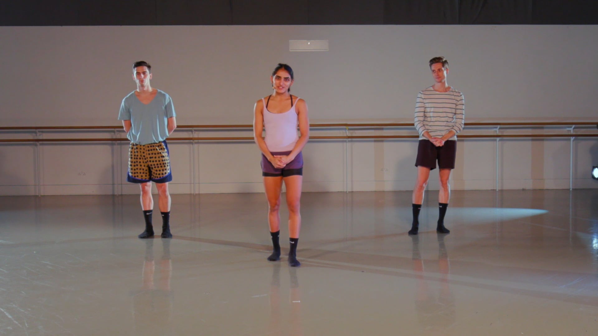 a group of people that are standing in a room.
