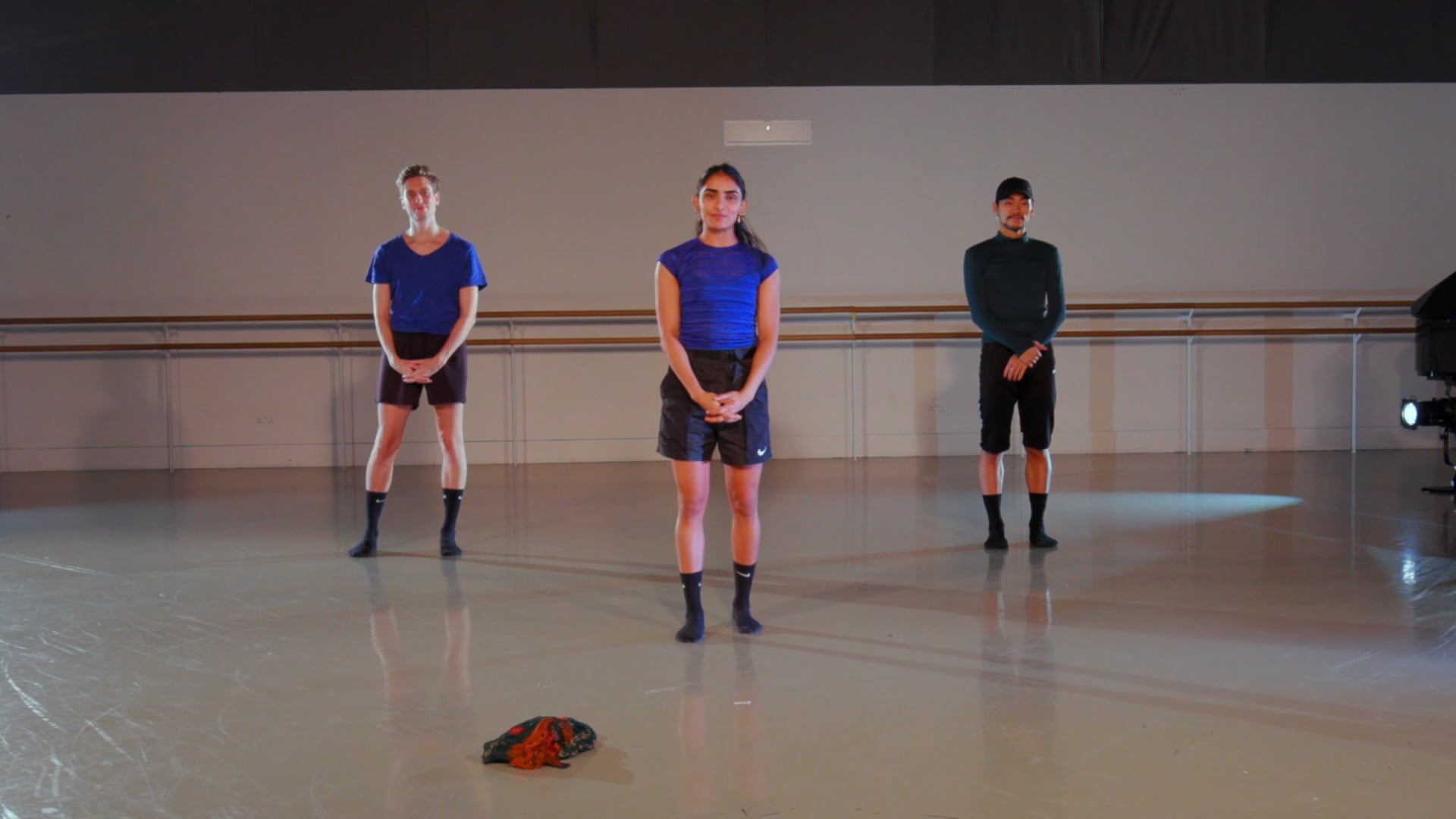 a group of people standing in a room.