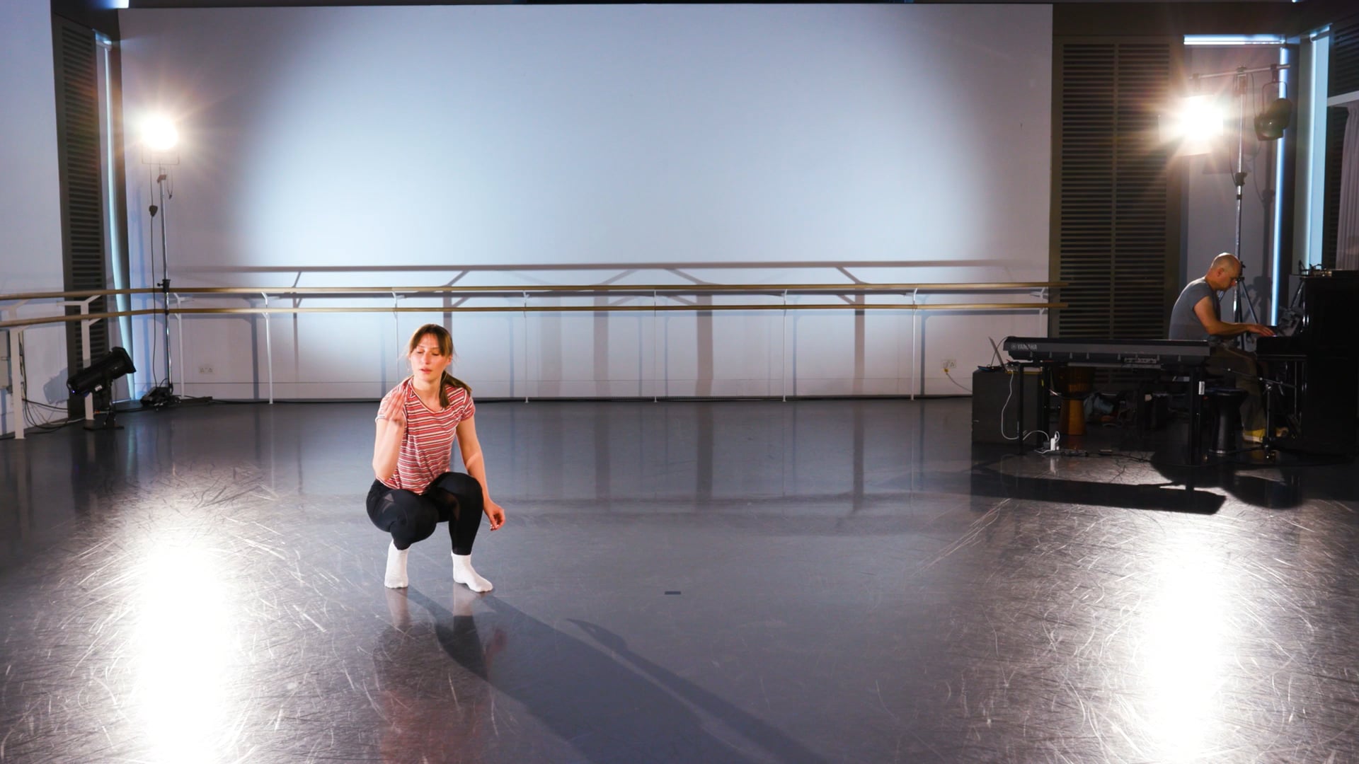 a woman standing on a stage in front of a projector.