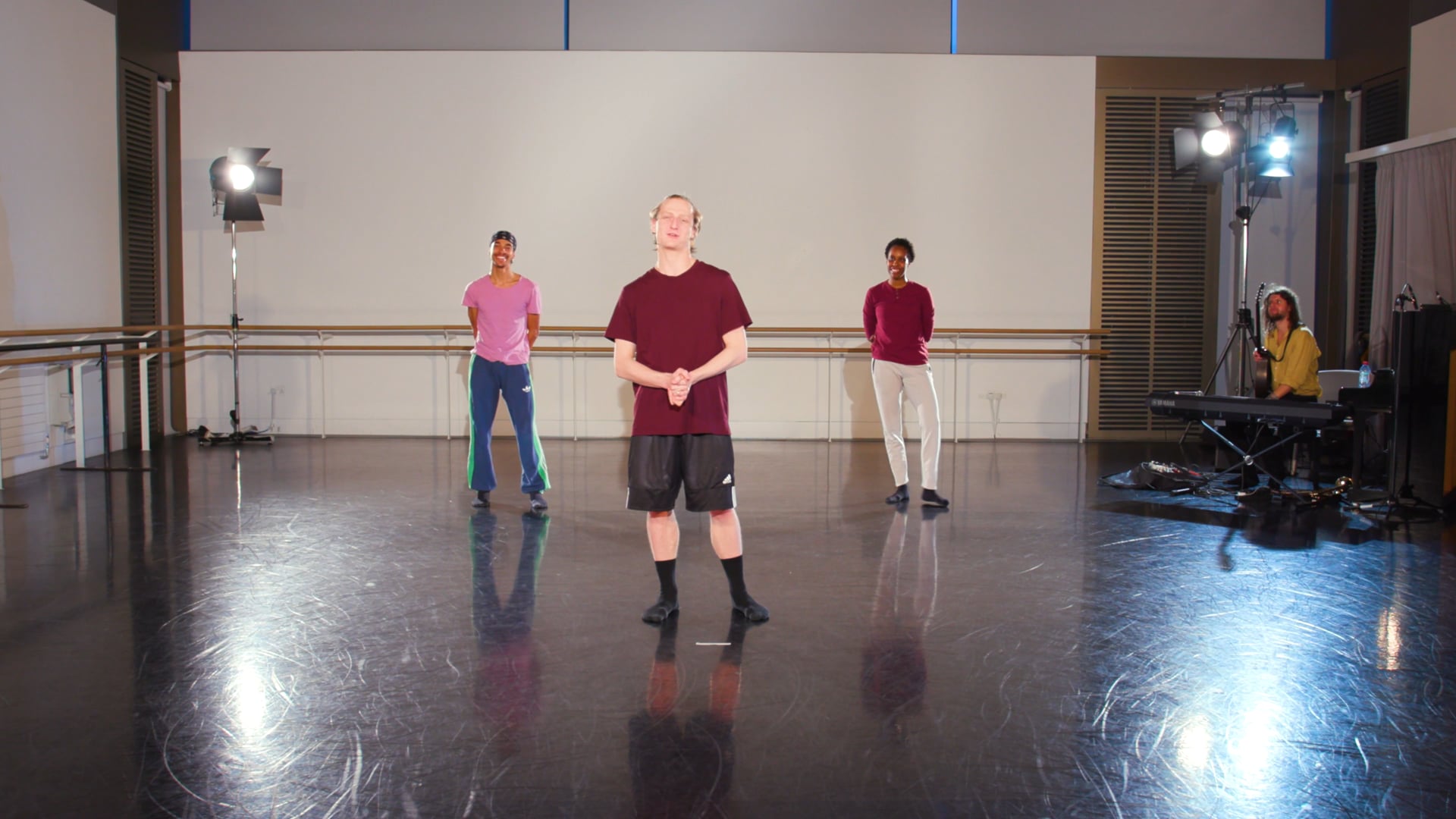 a group of people standing in a room.