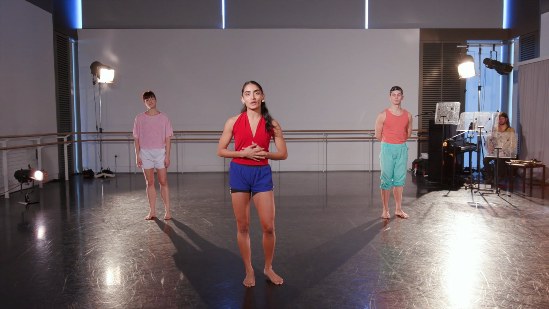 a group of people standing in a room.