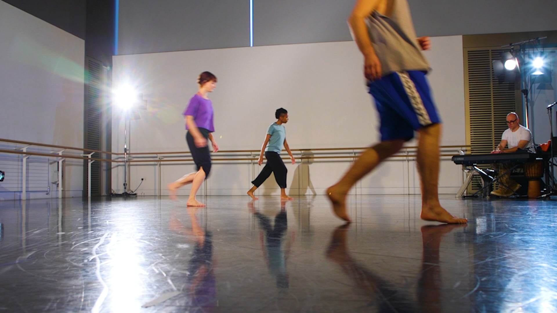 a group of people that are standing in a room.