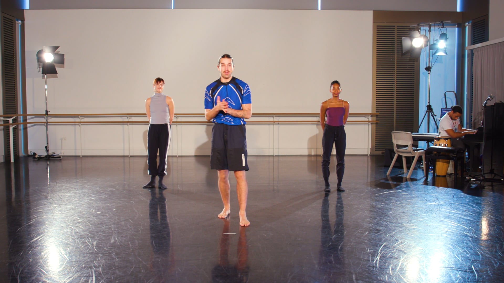 a group of people standing in a room.