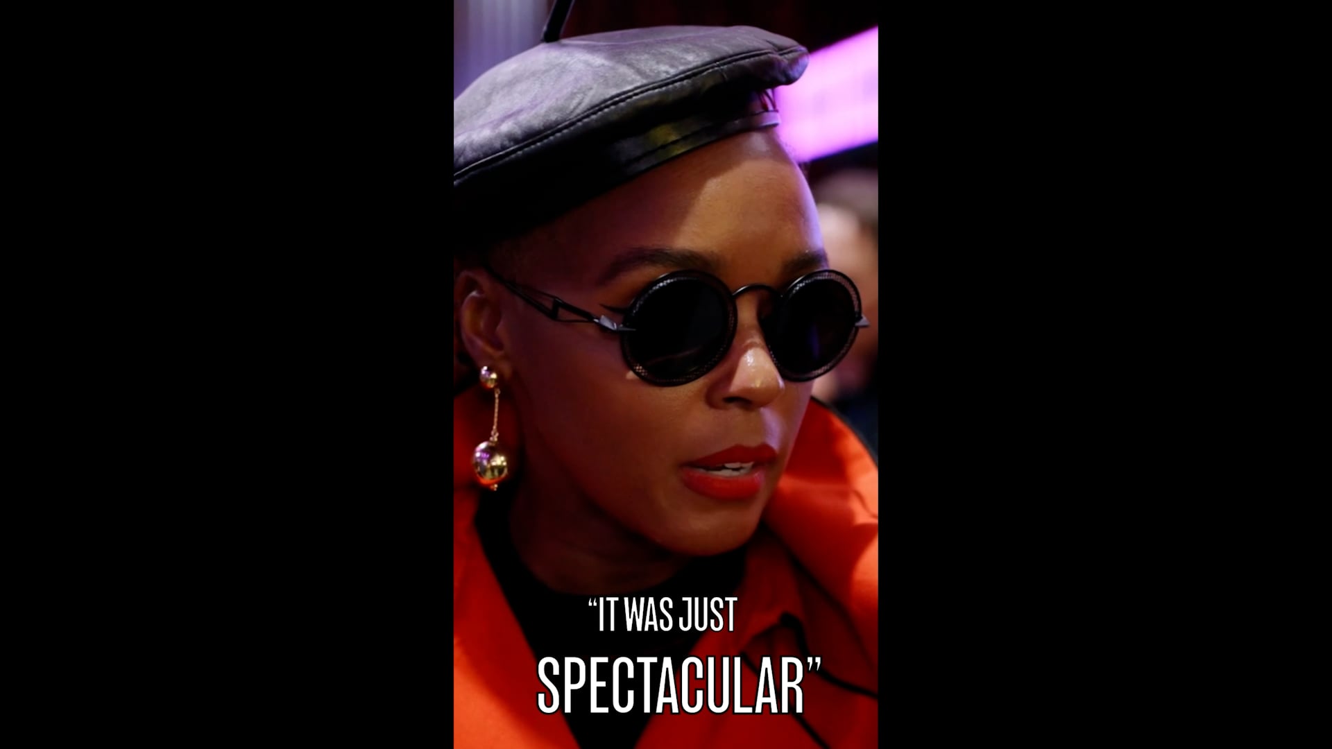 a woman wearing sunglasses and a hat.