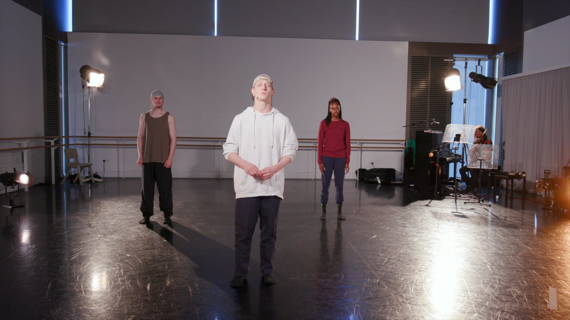 a group of people standing in a room.