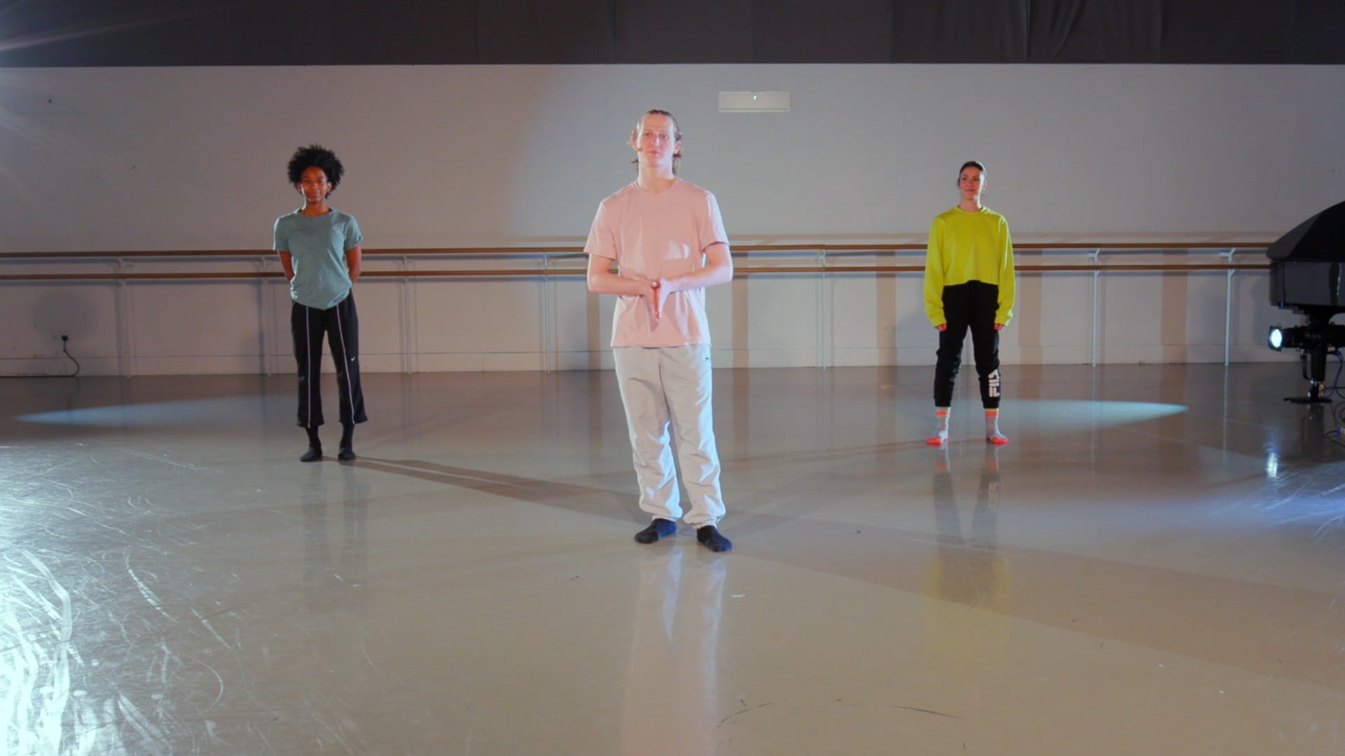 a group of people standing in a room.