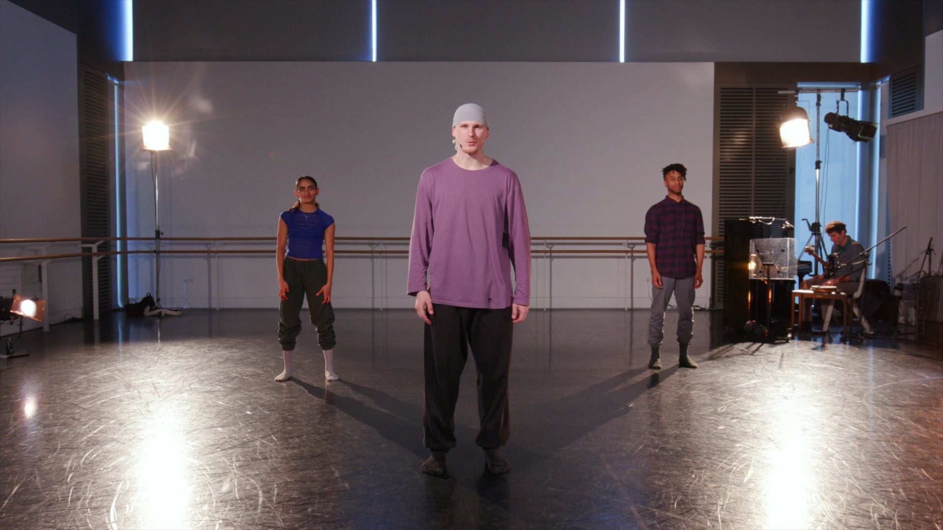a group of people standing on a stage.