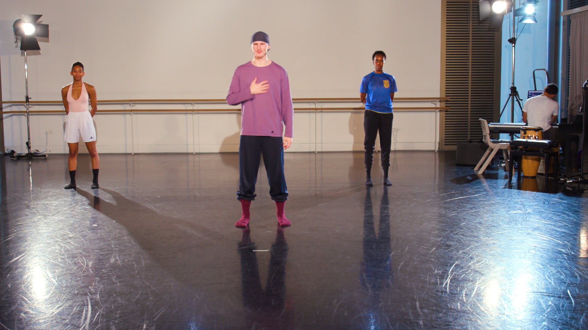 a group of people standing around in a room.