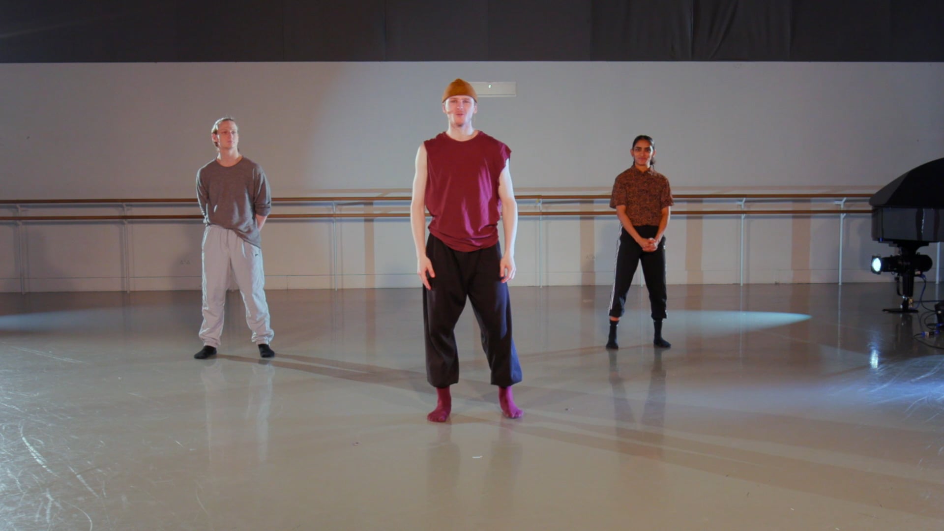 a group of men standing on top of a dance floor.