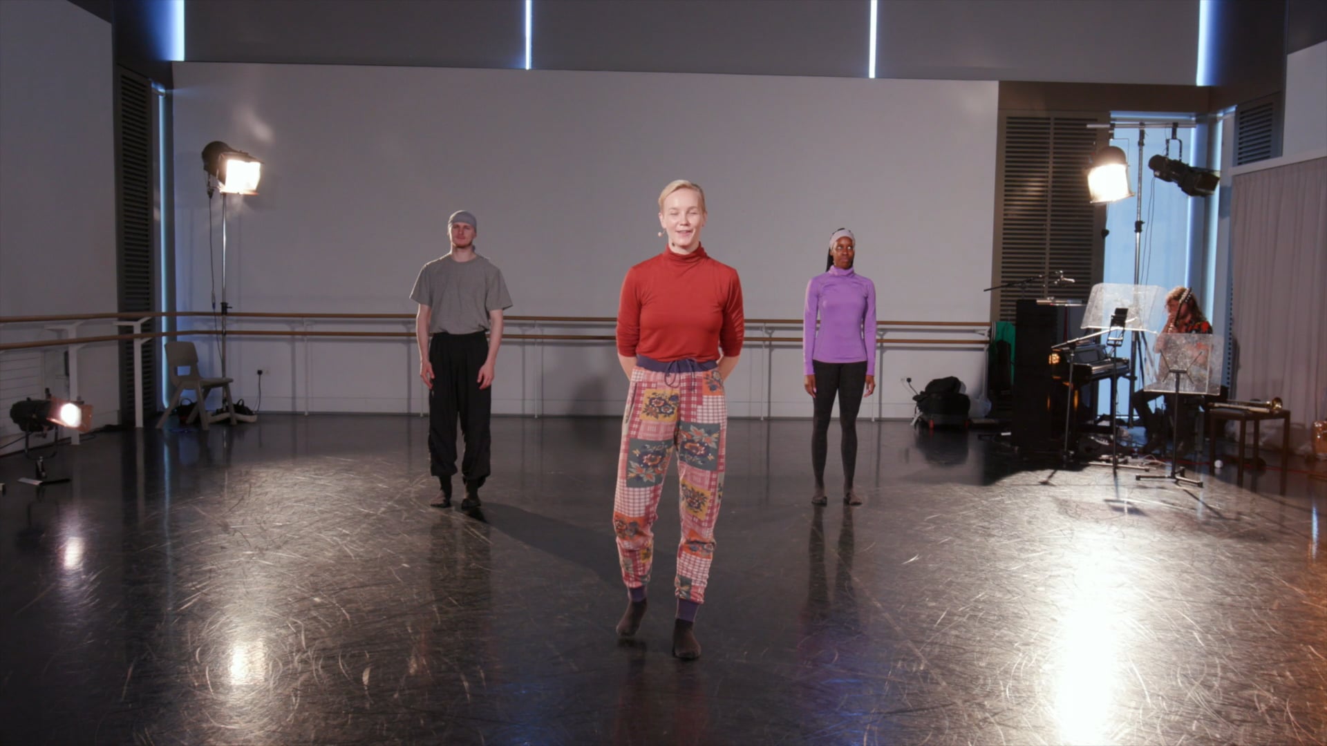 a group of people standing in a room.