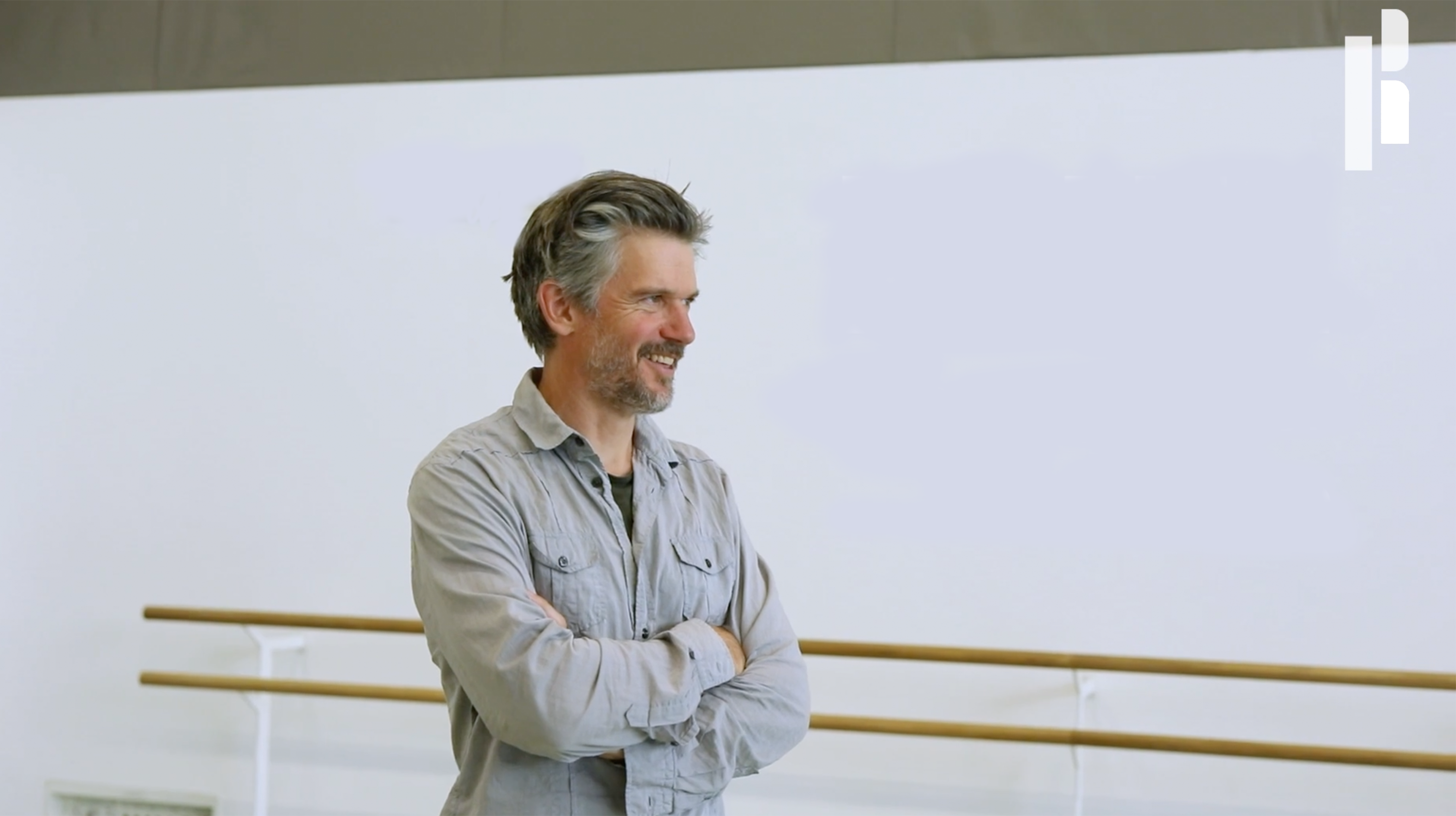 Choreographer Ben Duke with a dark grey shirt inside Rambert's studio during one of the production rehearsals