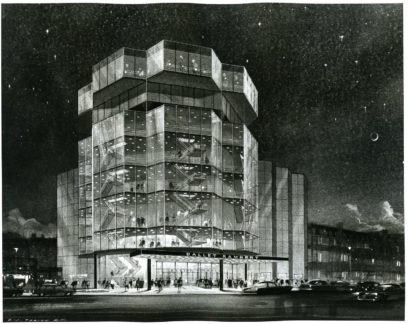 Black and white image of a multi-story building with geometric glass exterior lit up at night. People are visible at the entrance and cars are parked along the street.