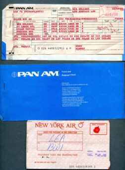 Three vintage airline tickets: a PAN AM ticket from New Orleans to Los Angeles, a blue PAN AM envelope, and a New York Air ticket to an unspecified destination.