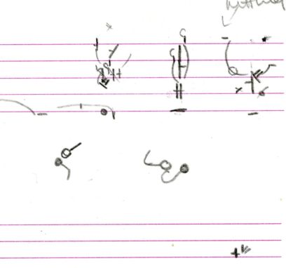 Handwritten sketch with lines, circles, and arrows on lined paper. A few scattered, unidentifiable symbols and markings are also present.